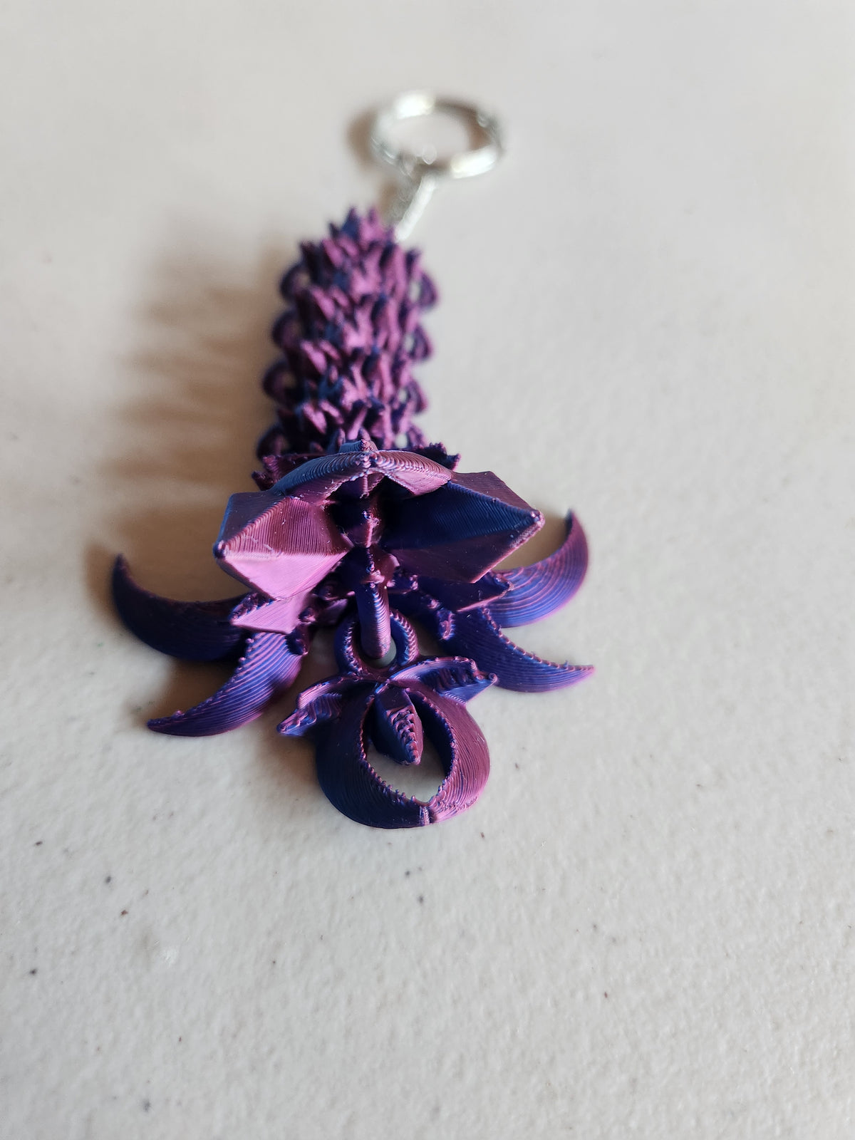 Nightwing tail keychains