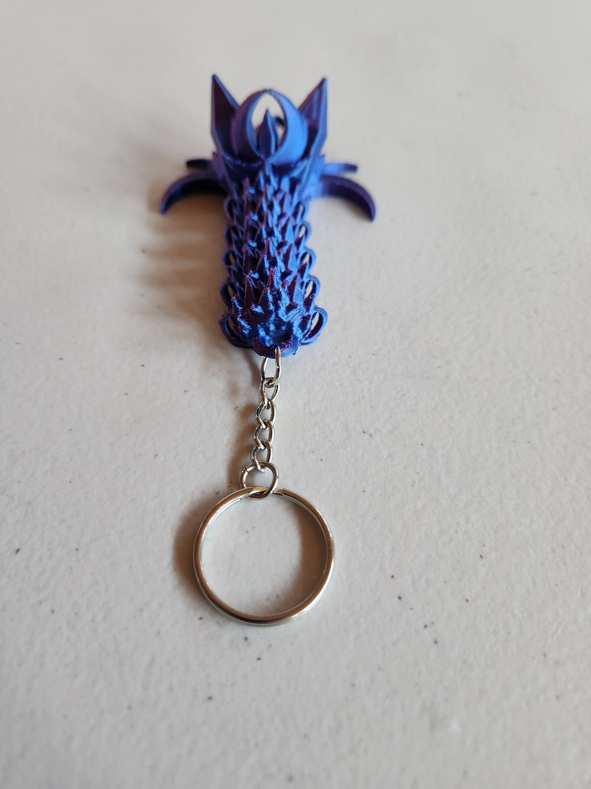 Nightwing tail keychains