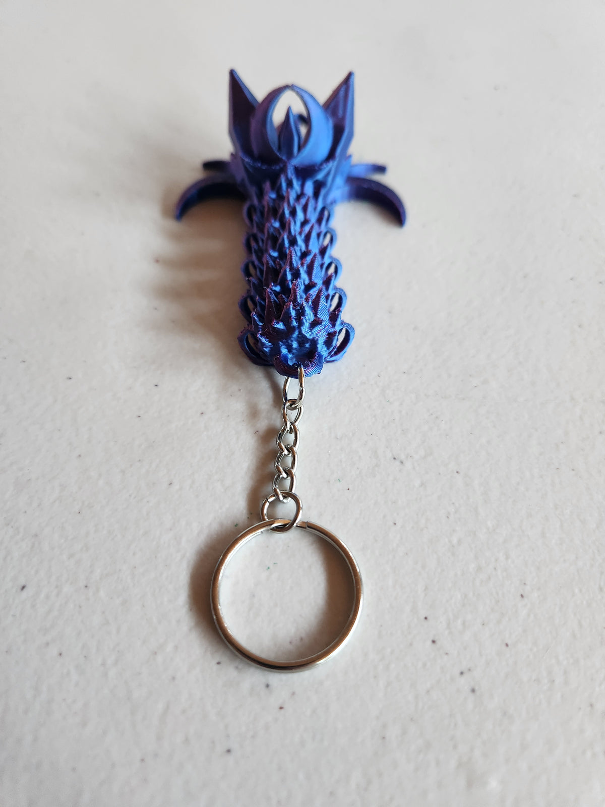 Nightwing tail keychains