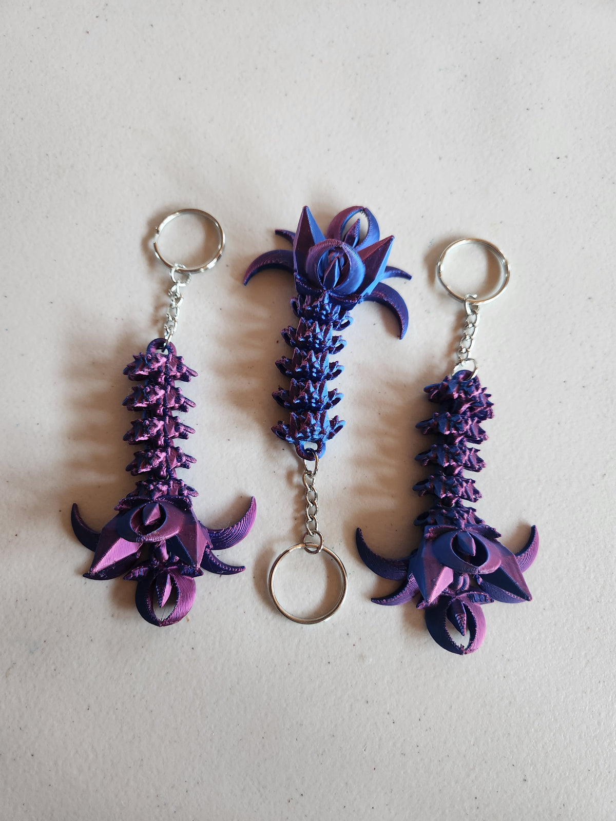 Nightwing tail keychains