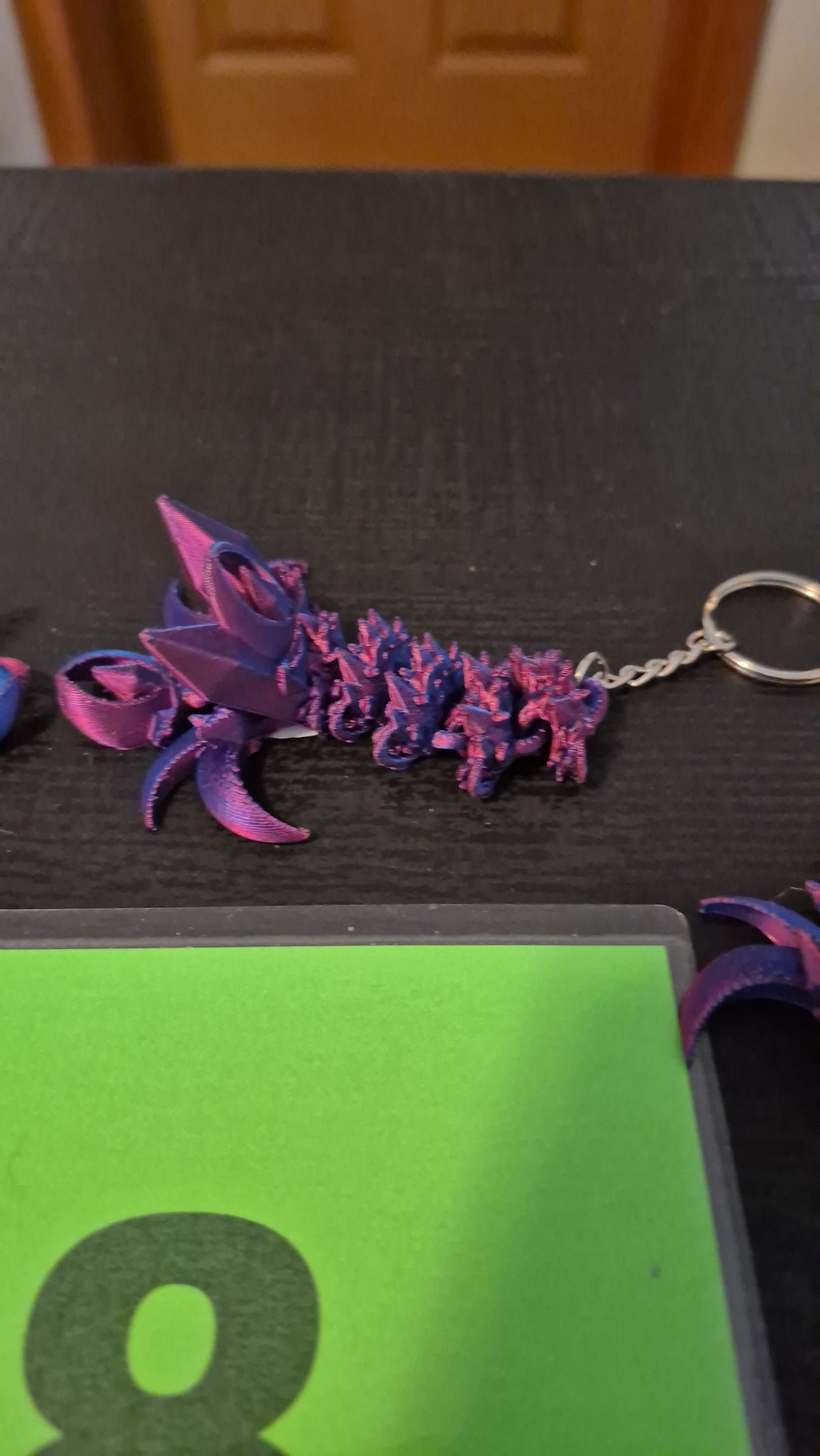 Nightwing tail keychains