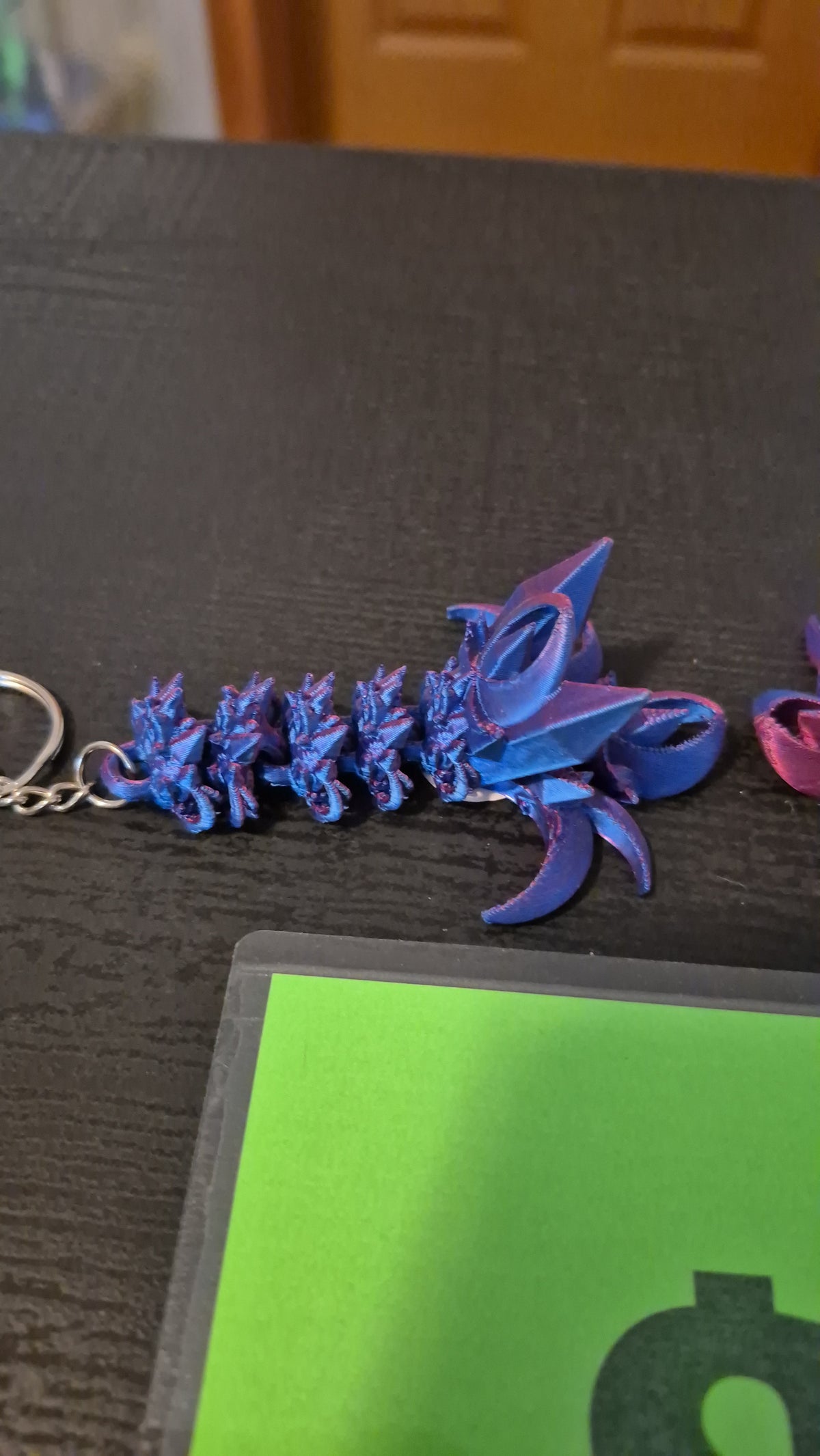 Nightwing tail keychains